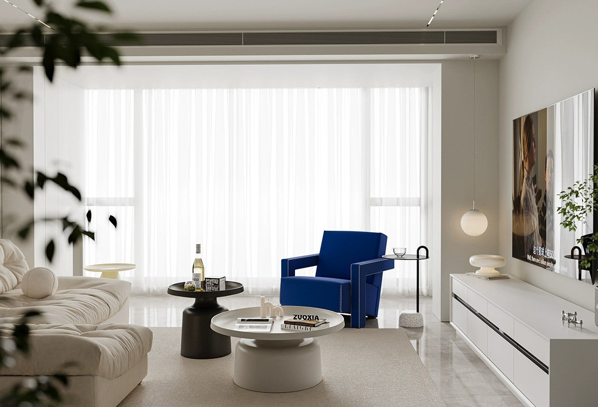 A sleek leather sofa paired with a glass-topped table for a clean, airy look.
