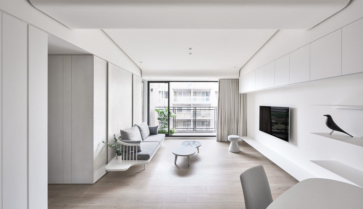 "A well-organized living room with multi-functional furniture and hidden storage solutions."