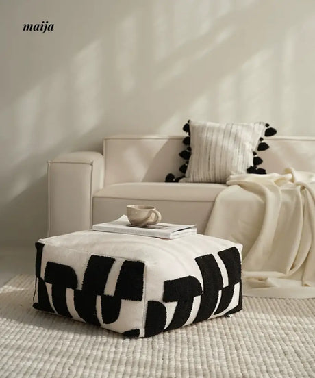BACKTOBUTU Black and White Geometric Pouf from maija