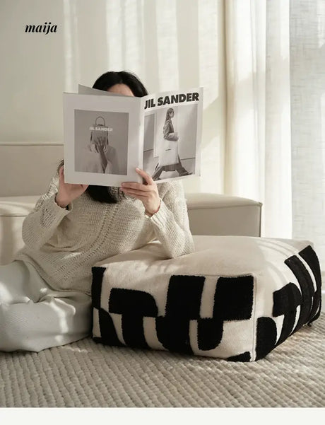 BACKTOBUTU Black and White Geometric Pouf from maija