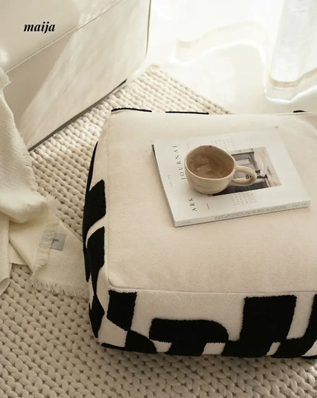 BACKTOBUTU Black and White Geometric Pouf from maija