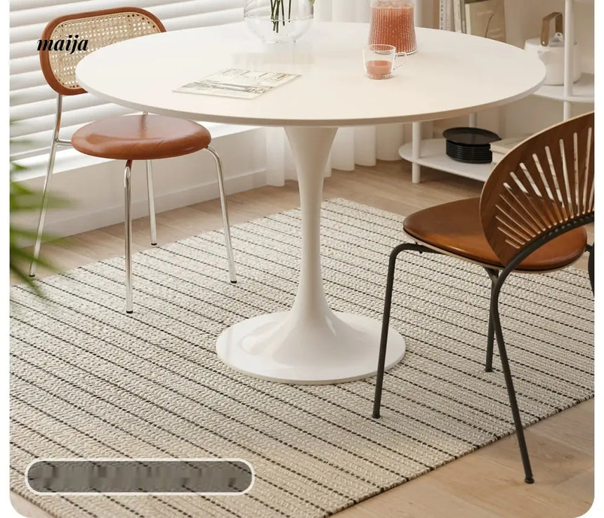 LOWERLEFT Tulip Round Dining Table from Lower Left