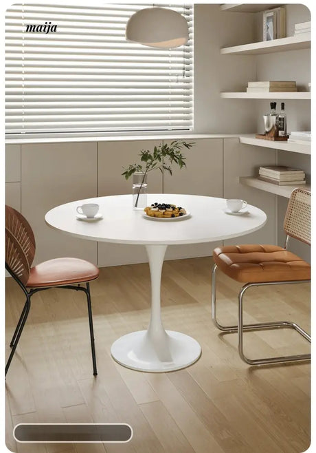 LOWERLEFT Tulip Round Dining Table from Lower Left