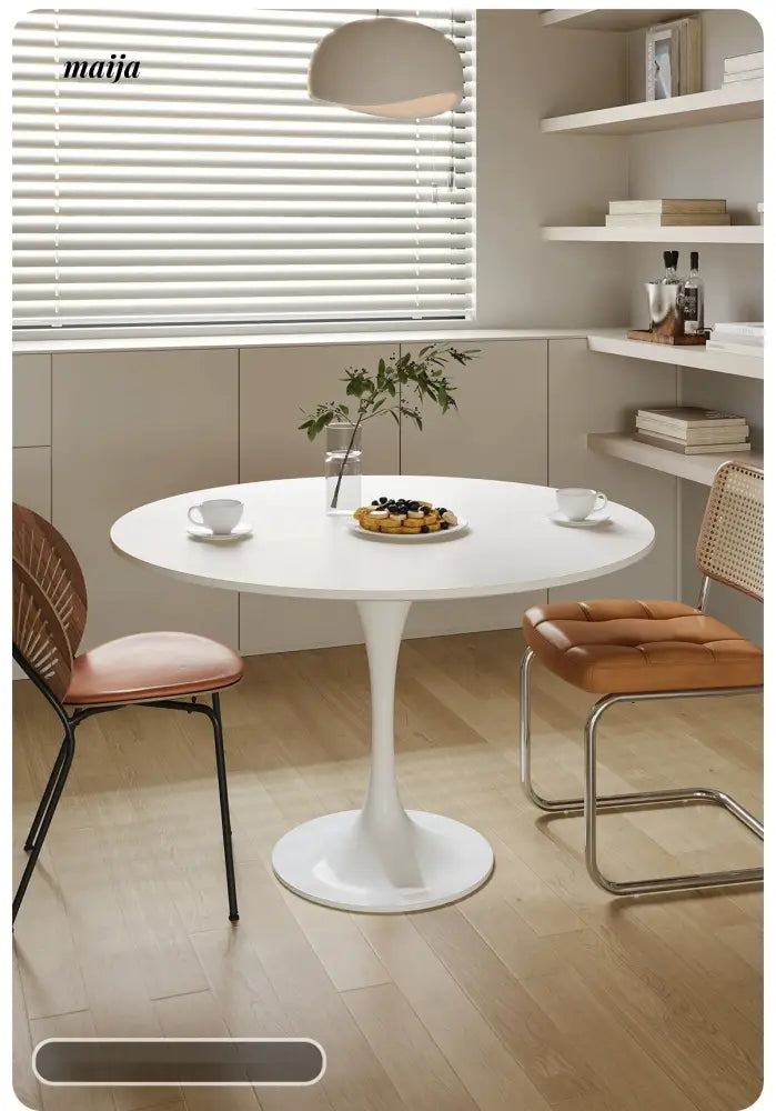 LOWERLEFT Tulip Round Dining Table from Lower Left