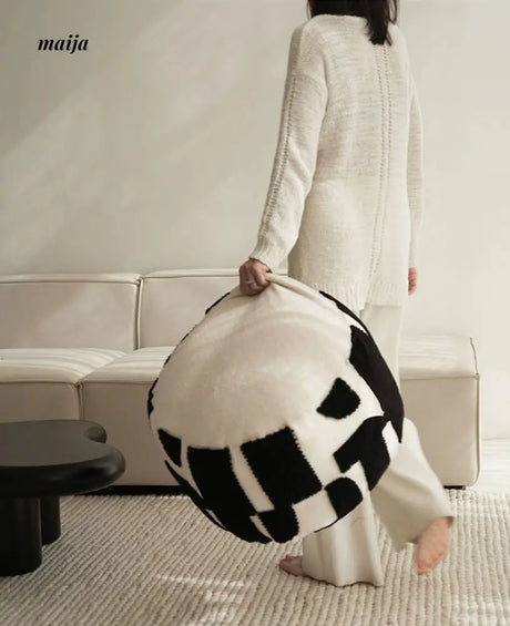 BACKTOBUTU Black and White Geometric Pouf from maija