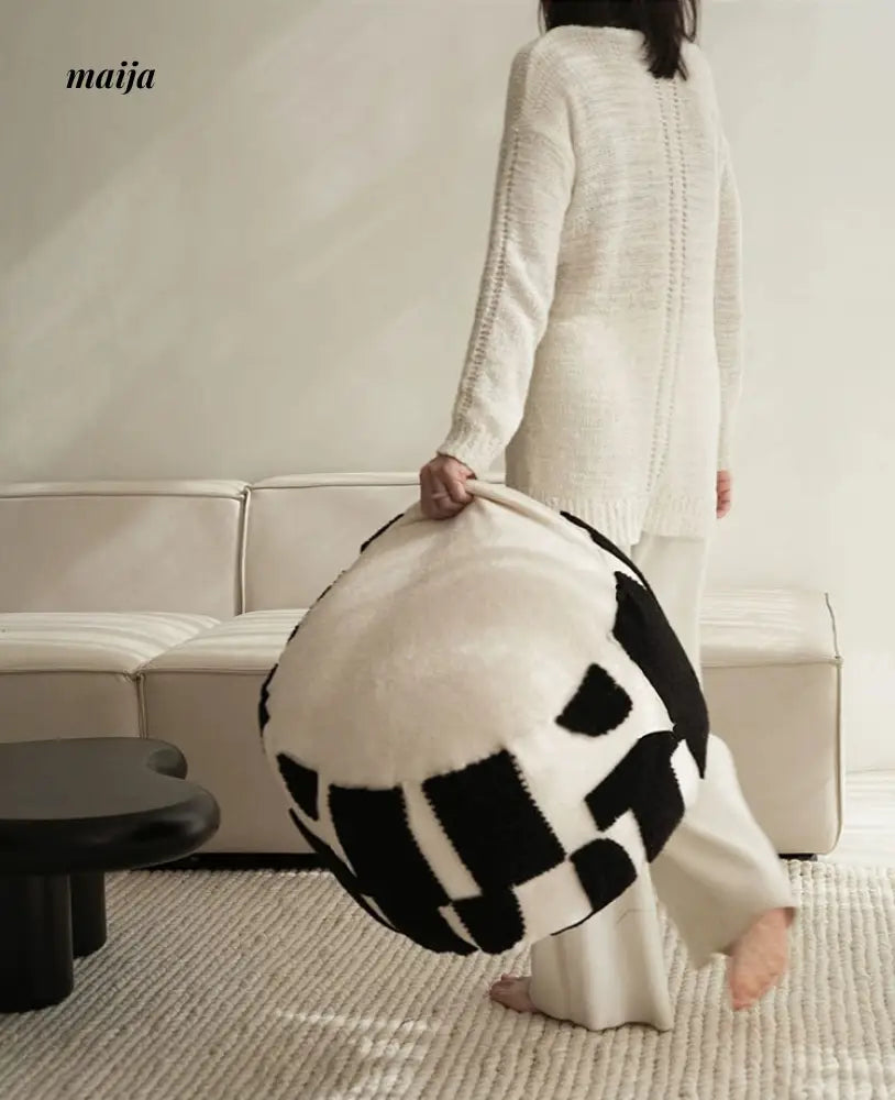 BACKTOBUTU Black and White Geometric Pouf from maija