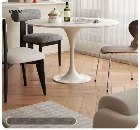 LOWERLEFT Tulip Round Dining Table from Lower Left