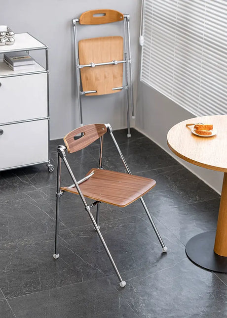 ABOUT WHITE Marcellus Sleek Folding Dining Chair from ABOUT WHITE