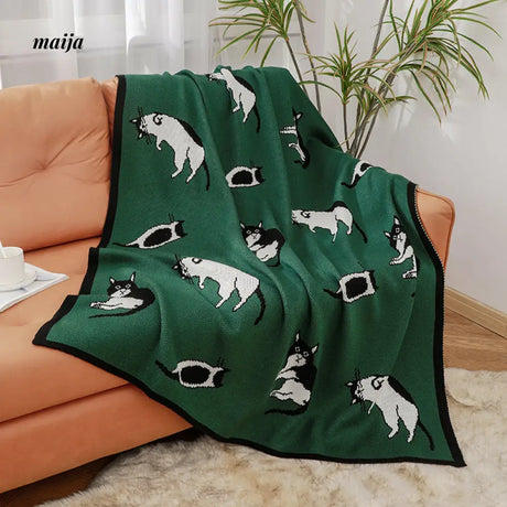 Lounging Cat Green Retro Blanket from maija