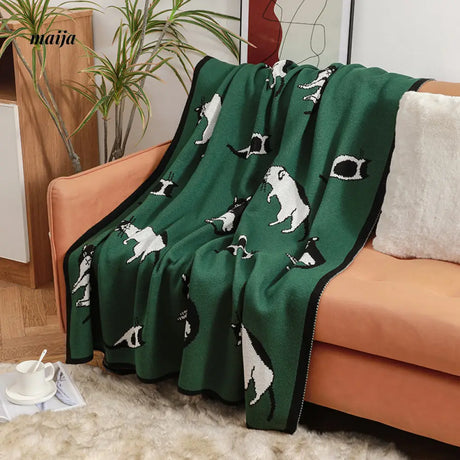 Lounging Cat Green Retro Blanket from maija