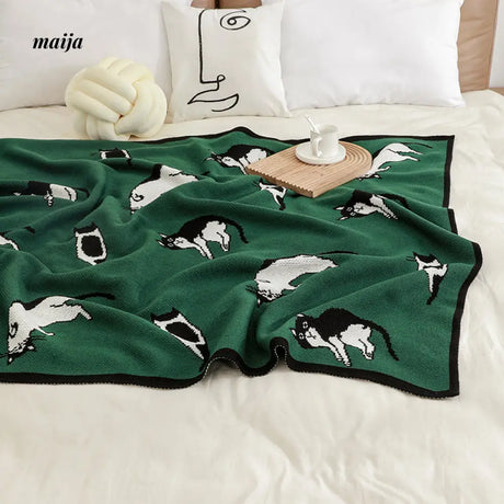 Lounging Cat Green Retro Blanket from maija