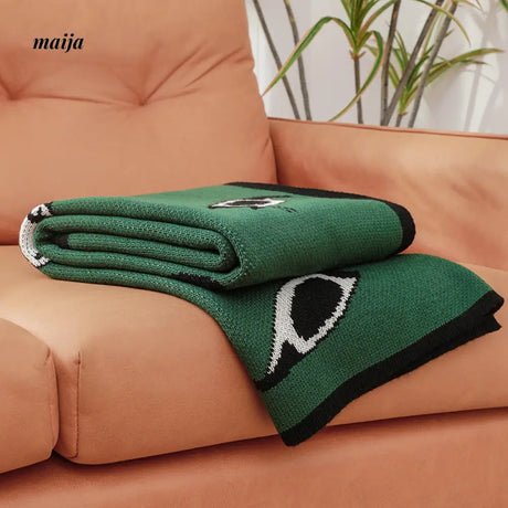 Lounging Cat Green Retro Blanket from maija