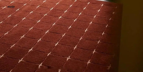 UNDERLAND Quilted Oyster Theater Rug from UNDERLAND