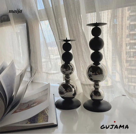 Black Metal Sphere Candle Holders from GUJAMA