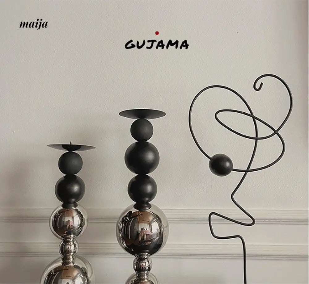 Black Metal Sphere Candle Holders from GUJAMA