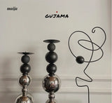 Black Metal Sphere Candle Holders from GUJAMA