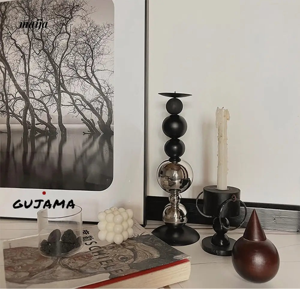 Black Metal Sphere Candle Holders from GUJAMA